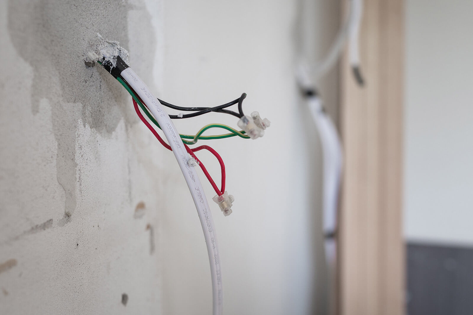 Exposed wiring during a house rewire carried out by LH Electrical in East Sussex