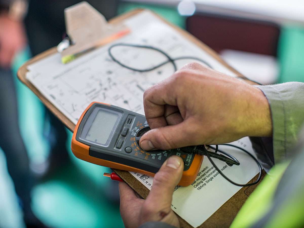 LH Electrical carrying out an EICR test and completing a landlord compliance checklist