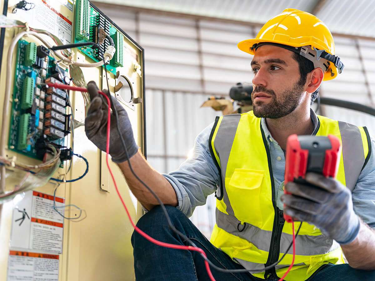LH Electrical carrying out electrical testing with a multimeter